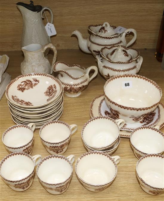 A Dudson stoneware pewter-mounted relief-moulded jug, a similar Cobridge jug and a Garrett & Copeland part service, etc.